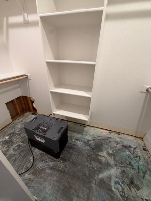 The same closet with the flooring removed. We couldn't use it for months while the leak went unrepaired